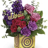 Pink and purple roses with carnations in a gold vase