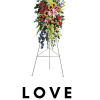Standing floral spray with mixed flowers on an easel