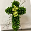 Green floral cross with orchids and twisting branches