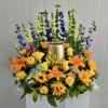 This Butterfly Garden Wreath includes Bells of Ireland, Yellow Snapdragon, Blue Delphinium