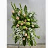 This Standing Spray Includes White Stock, White Dendrobium Orchids, Bells of Ireland