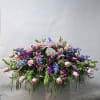 This Large Casket Spray Includes Purple Dendrobium Orchids, Purple Stock, Blue Hydrangea