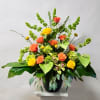 This Arrangement Includes Green Cymbidium Orchid Blooms, Green Anthurium, Yellow Rose, Orange