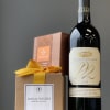 Gift set with a candle box and a bottle of red wine