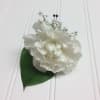 A traditional carnation boutonniere that can be done in any color upon