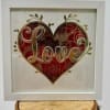 Framed heart artwork with the word Love in the center