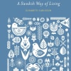 Blue book cover with white folk-art birds and floral motifs