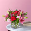 Entrance them with this charming arrangement of roses, carnations, Alstroemeria, Matsumoto Asters