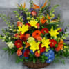 Colorful mixed flower arrangement in a wicker basket