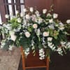 Grand arrangement with soft peach roses spiked throughout and elegant light green