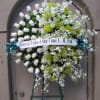 Lush and elegant wreath adorn with white and green roses, accented with