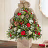 boxwood xmas tree in a wooden cube with fresh flowers and decor
picture