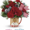 red carnations and roses in a mug with ribbon and xmas accents
picture