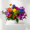 Colorful mixed bouquet in a white vase