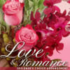 Pink roses with deep red orchids and greenery