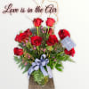 1 dozen red roses with greenery and filler 