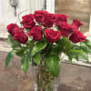 A timeless bouquet of rich red roses accented with delicate white blossoms