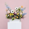 A pretty mix of pastel,  premium blooms which include roses, lisianthus
