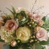 Bouquet of pale pink roses, white hydrangea, and green cabbage roses