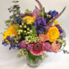 Colorful mixed bouquet in a clear glass vase