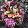 Mixed bouquet with pink roses, lilies, hydrangeas, and gerbera daisies