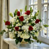 Red roses create a powerful and meaningful tribute, symbolizing courage, respect, and