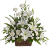 White lilies and carnations in a wicker basket