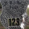 Large silver floral tribute with "City of Hoboken Police" and "129" lettering