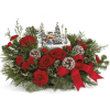 Red roses and carnations with a Christmas village centerpiece