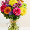 Colorful mixed bouquet in a clear glass vase