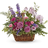 This lush lavender rose arrangement is a basket of beauty to brighten