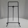 Black metal display stand on a white surface