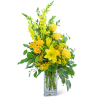 Yellow floral arrangement in a clear glass vase