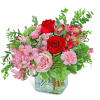 Pink and red mixed bouquet in a clear glass vase