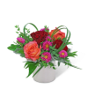 Bouquet of red and orange roses with pink daisies in a white vase