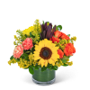 Sunflower and orange rose bouquet in a glass vase