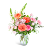 Pink and coral flower arrangement in a clear glass vase