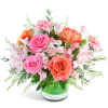 Pink and coral mixed bouquet in a glass vase