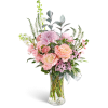 Pink roses and chrysanthemums in a clear glass vase