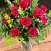 Bouquet of red roses in a clear glass vase