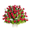Large bouquet of red roses with fern foliage in a white wrap