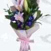 Pink and white lily bouquet with purple orchids wrapped in pink paper