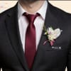 Make a lasting impression with this elegant exotic cymbidium orchid boutonniere, designed
