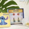White orchid beside Stitch-themed jewelry boxes