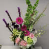 Tall mixed bouquet in a glass vase with pink and white flowers