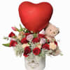 A beautiful box of mix flowers, roses carnations tulips and greens. Joined