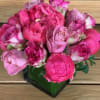 Bouquet of pink roses in a black wrap
