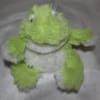 Green and white plush frog toy with fuzzy texture