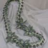 A bold, celebratory twist on a traditional gift-this green-and-white money lei turns