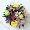 A lush, garden-style flower arrangement- perfect as a birthday bouquet or a